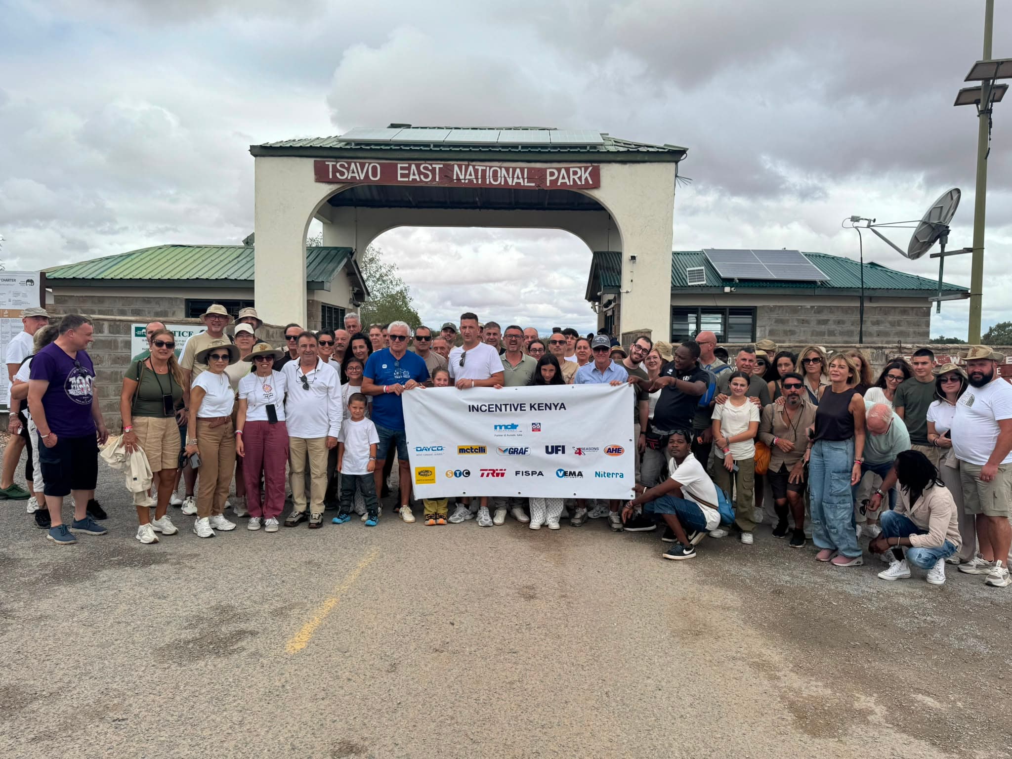 Travelers gathered at the Tsavo East National Park entrance gate